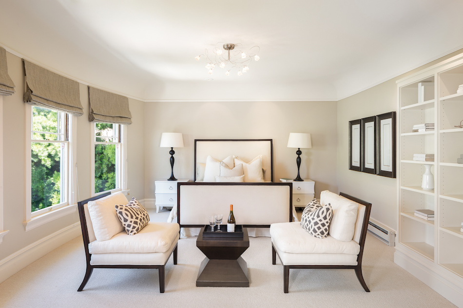 Contemporary bedroom with side tables and ceiling lights