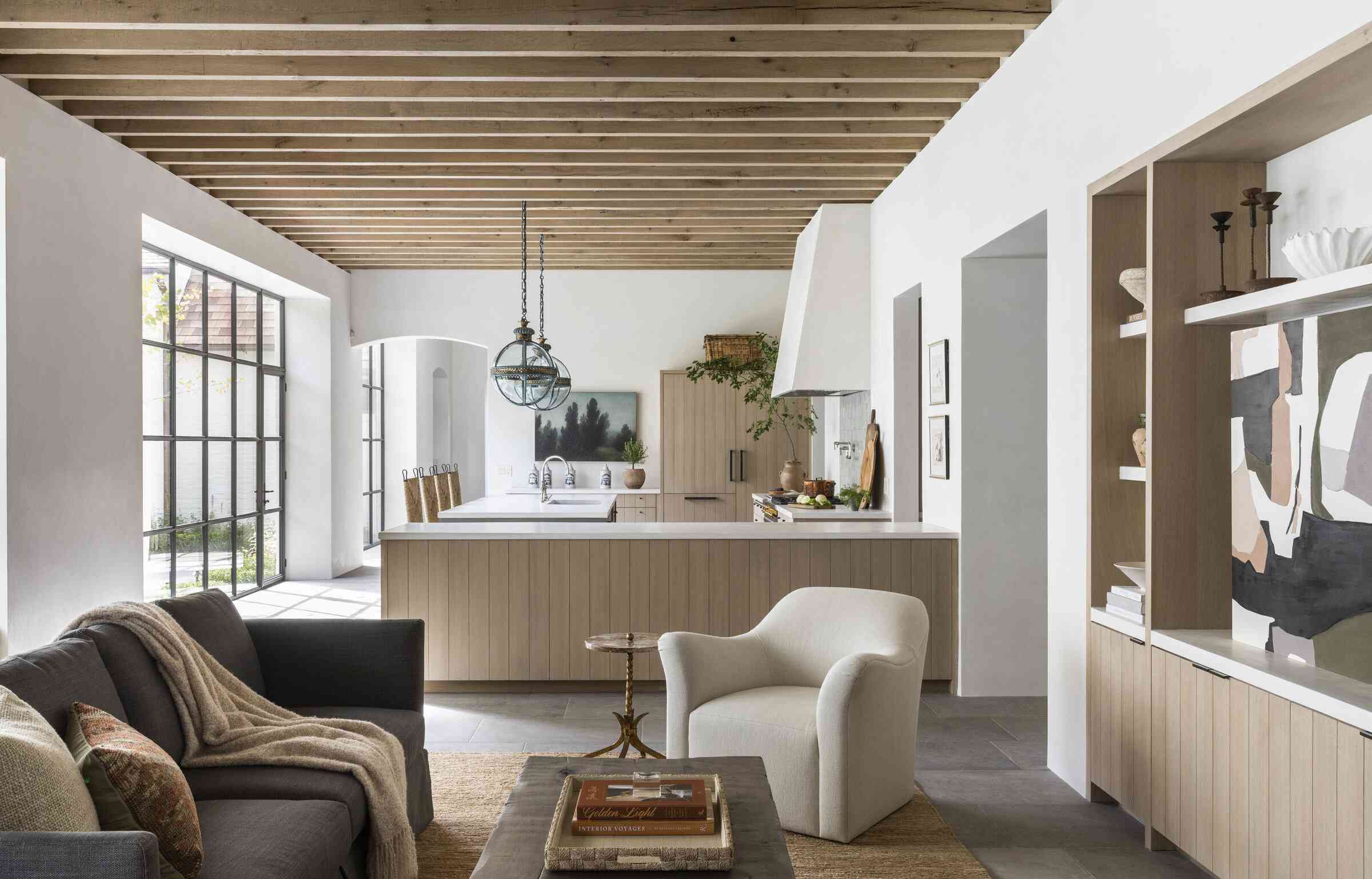 Open-concept layout, custom cabinetry, statement stone, full luxury staging