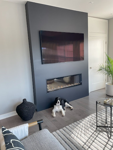 Warm lounge interior with fireplace and rug