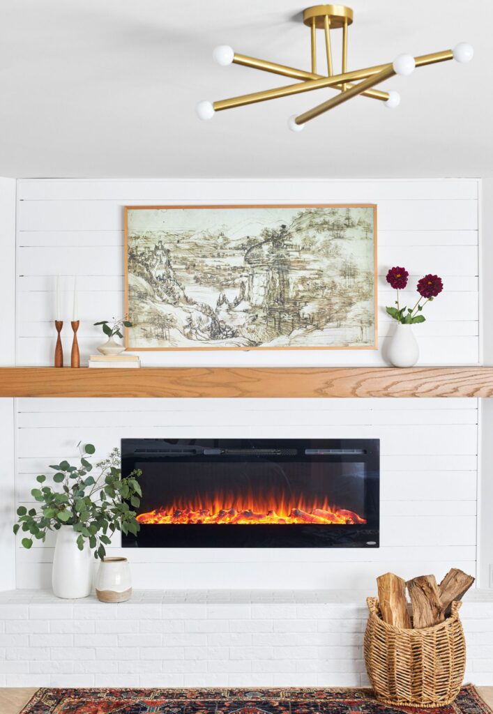 Fireplace below TV wall unit in modern living room