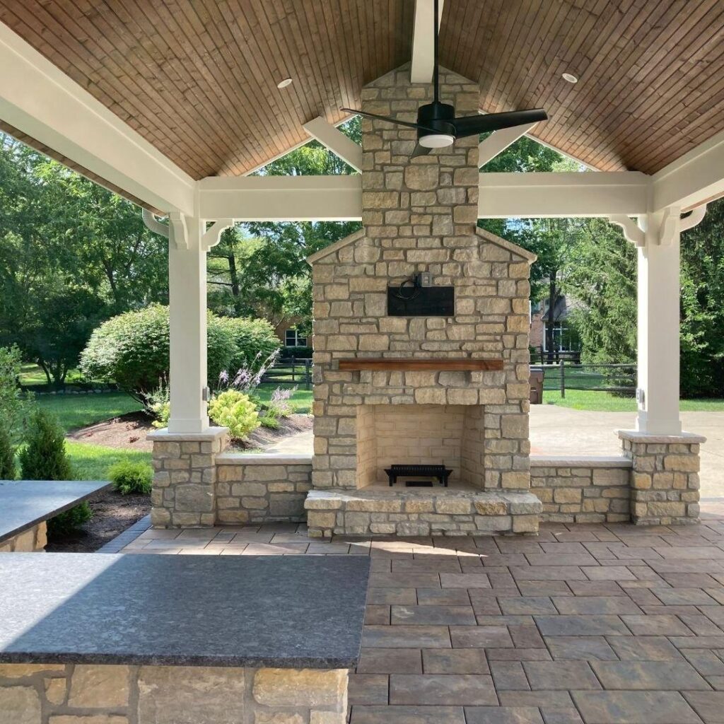 Outdoor garden fireplace with seating area